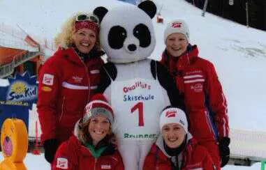 Instructors with the panda mascot